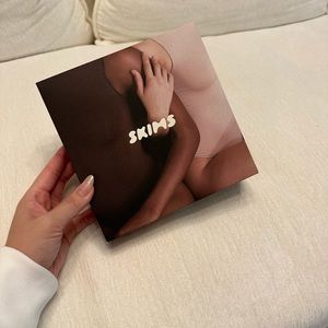 Skims essential scope neck bodysuit in color marble size S/M